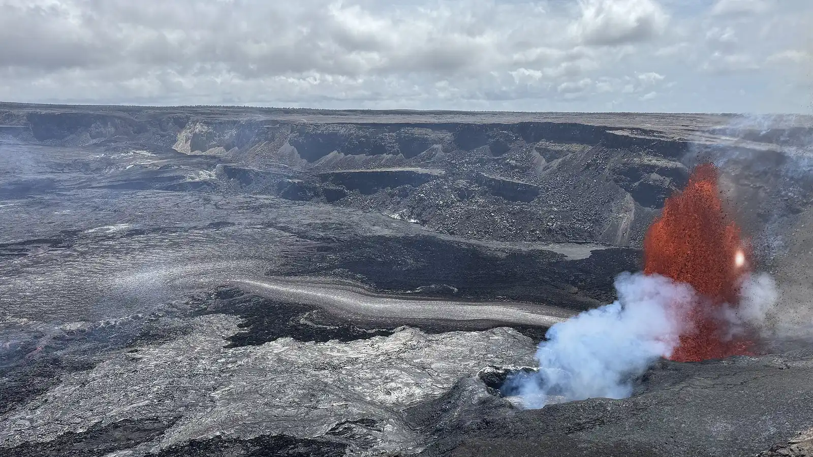A lava fountain shooting out of a vent in Halemaumau crater on the Kilauea volcano.